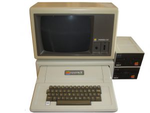 Photo of an Apple II+ with Apple monitor and two external disk drives